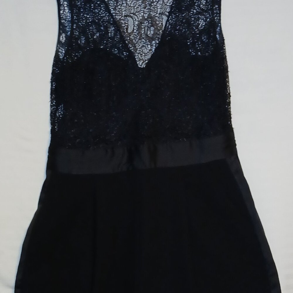 Black lace tuxedo jumpsuit size 12 By BCBG